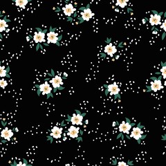 Seamless vintage pattern. white 
 flowers and dots, green leaves.  black background. vector texture. fashionable print for textiles, wallpaper and packaging.