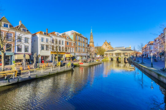 Netherlands, South Holland, Leiden, Row of townhouses along city canal