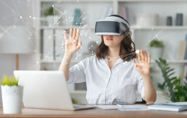 Woman with VR virtual reality goggles