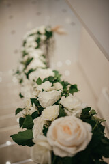 Decoration with fresh flowers, candles, light bulbs, garlands. Vintage style. Table setting for an event party or wedding reception. Event decorations.
