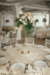 Decoration with fresh flowers, candles, light bulbs, garlands. Vintage style. Table setting for an event party or wedding reception. Event decorations.
