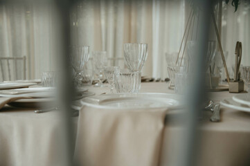 Decoration with fresh flowers, candles, light bulbs, garlands. Vintage style. Table setting for an event party or wedding reception. Event decorations.