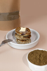 Syrniki, cottage cheese fritters or curd pancakes, made from curd and hemp flour. Low carb Ketogenic diet.