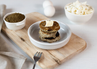 Syrniki, cottage cheese fritters or curd pancakes, made from curd and hemp flour. Low carb Ketogenic diet.