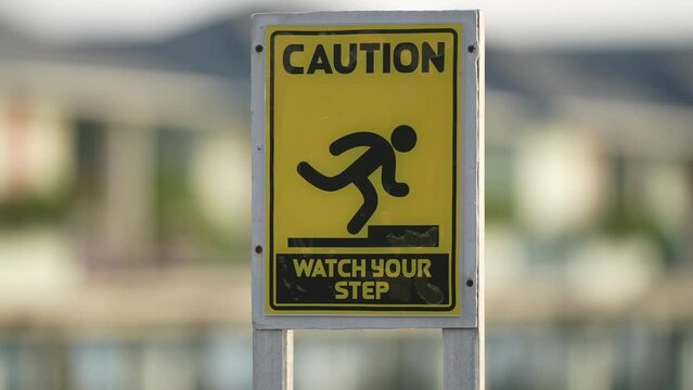 Sign animation: Watch your step on white background. Attention and warning. Be careful. Dangerous concept.
