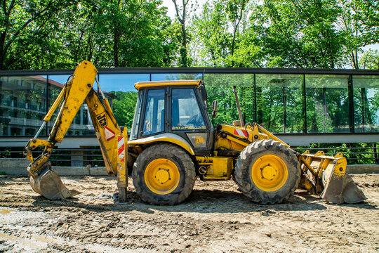 Large yellow construction excavator on construction site. Industrial image.