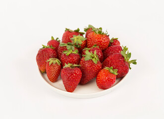 strawberries in bowl on white background