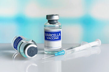 Two vials with vaccine doses for chickenpox Varicella virus disease. Vaccination for booster shot...