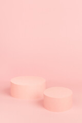 Sweet girlish pastel pink stage mockup with  two circle podiums for advertising, presentation cosmetic product or goods, design on soft light background, copy space, vertical.