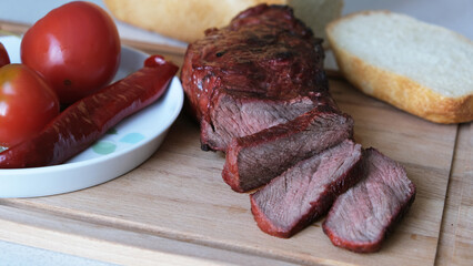 steak - a thick piece of grilled meat and vegetables