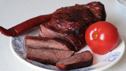 steak - a thick piece of grilled meat and vegetables