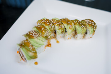 Japanese cuisine roll with avocado and sesame seeds