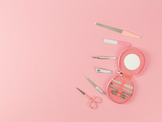 nail care supplies on pink background