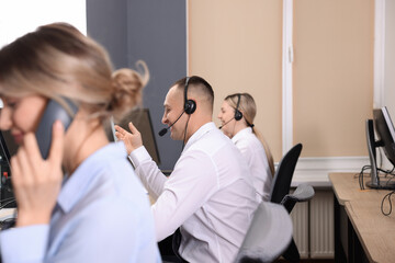 Call center operators working in modern office