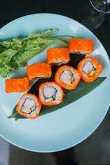 Japanese roll with tuna and white rice in tobiko caviar
