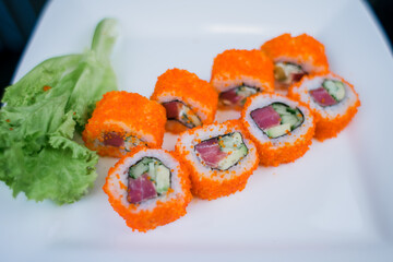Japanese roll with tuna and white rice in tobiko caviar