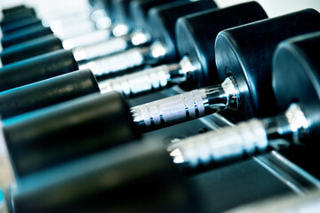 Naklejka premium Rows of dumbbells in the gym