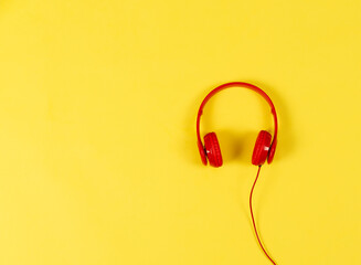 red headphones on yellow background