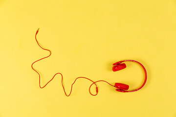 red headphones on yellow background