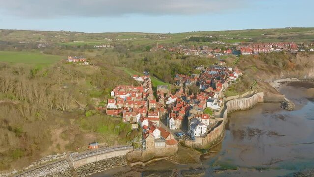 North York Moors Heritage Coast, Robin Hoods Bay, Aerial drone flight over RHB village, rotating around the slipway out at sea DJI Mavic 3 Cine Prores 422 March 2022 Clip 4