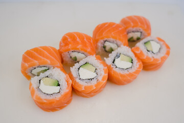 roll with salmon and white rice and cream cheese