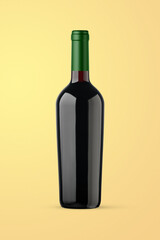 A red wine bottle isolated on a yellow background for mockup presentation projects.