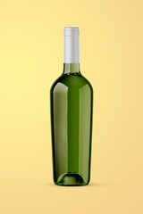 A green bottle of white wine isolated on a yellow background for mockup presentation projects.