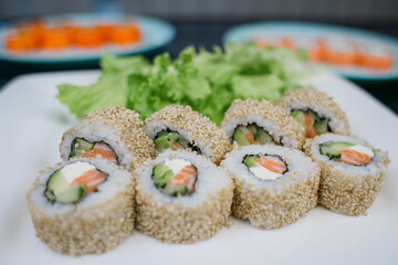 Philadelphia roll with salmon in sesame and white rice