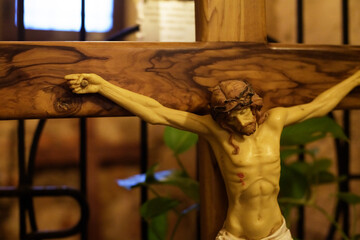 Crucifixion of Jesus Christ in a church. Jesus Christ on a wooden cross. Easter, resurrection...