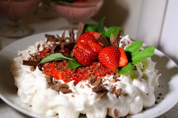 Strawberry cake with cream and mint with grated chocolate airy and incredibly tasty from natural products. High quality photo