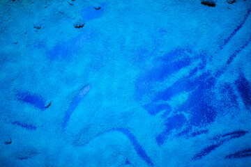 Background of blue scattered sand.Colorful sand and colored powder.