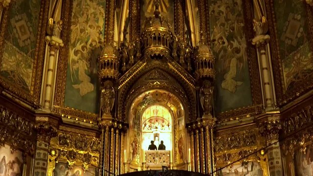 Monastery of Montserrat. Basilica of the Virgin Mary of Montserrat. Shrine of Catalonia statue of the Black Madonna. Altar part. Choir with seats for monks. Main altar. Church sculptures 