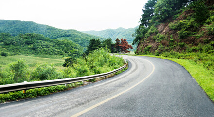 Curved asphalt road in high mountains