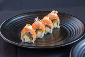 Salmon Roll on black backround.