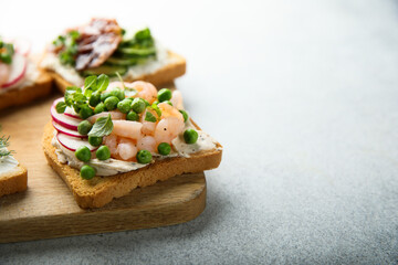 Shrimp toast with cream cheese, radish and green pea
