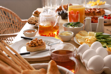 Dishes with different food on table in room. Luxury brunch