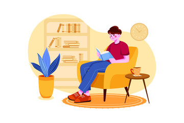 Man Reading A Book While Sitting At Home Comfortably