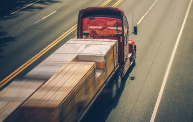 Speeding Semi Truck with Wood Material Load