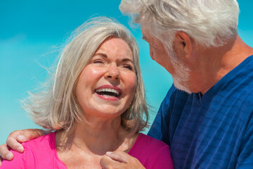 Happy retired couple peaceful together on tropical beach