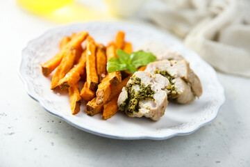Chicken with pesto and sweet potato fries