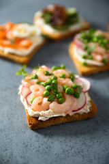 Shrimp toast with cream cheese, radish and green pea
