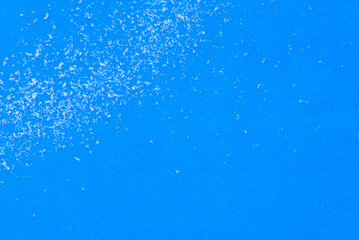 Snowflakes are white on a blue background (copy space).