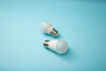 White light bulb on a blue background