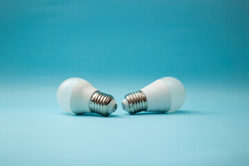 White light bulb on a blue background