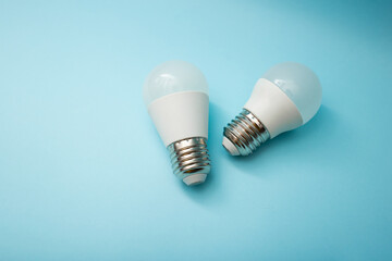 White light bulb on a blue background