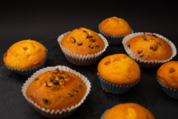 Juicy cupcakes on a black background, confectionery, bakery