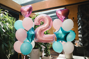 Coziness and style. Modern event design.  Balloons decoration for a child's birthday party dinner.