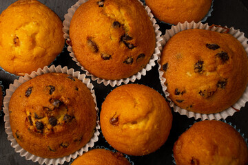 Juicy cupcakes on a black background, confectionery, bakery