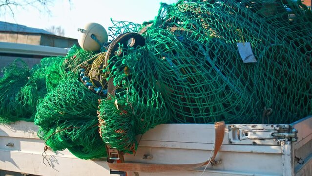 Pile of Tangled Up Professional Nylon Fishing Net with Buoys and Markers
