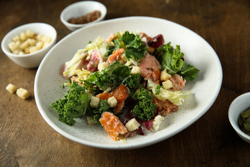 Kale salad with hot smoked salmon
